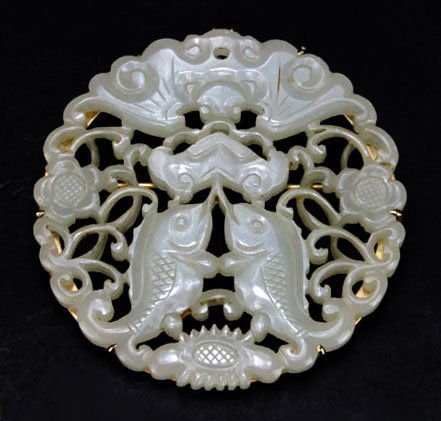 EXTRAORDINARY CHINESE WHITE JADE CARVED BROOCH WITH GOL: EXTRAORDINARY CHINESE WHITE JADE CARVED BROOCH WITH GOLD BEZEL Caved with Fish Design. Beautiful Reticulation. Measures Approximately 2" in Diameter. Early 20th Century. WE WILL SHIP THIS ITEM FOR $20