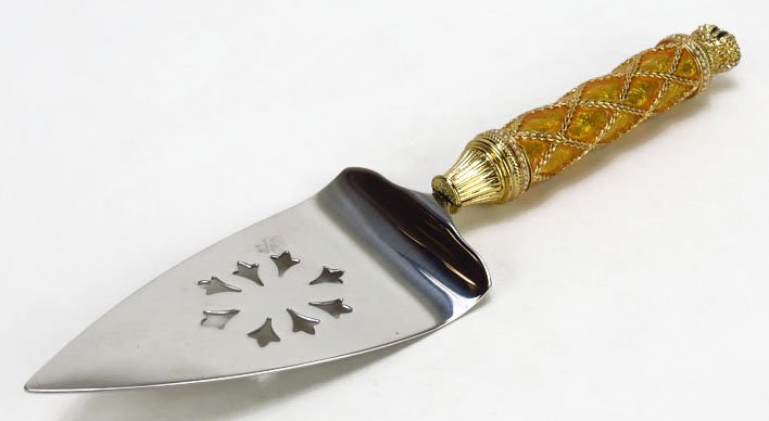 FABERGE ENAMELED IMPERIAL PIE SERVER: FABERGE ENAMELED IMPERIAL PIE SERVER Measures 10" long with gold enameled handled seed pearl design onyx to handle in the shape of a crown. Comes in original presentation box. Excellent Condition. We 