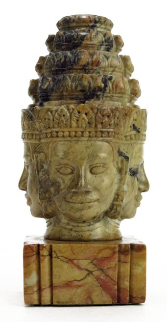 VINTAGE CAMBODIAN CARVED FOUR FACES OF GOD: VINTAGE CAMBODIAN CARVED FOUR FACES OF GOD Measures 5" tall and sits on a 1.5" marble base. Early 20th century. We will not ship this lot but we can recommend one of our local shippers.