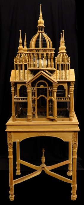 HAND CARVED VINTAGE LARGE BIRD CAGE AND TABLE: HAND CARVED VINTAGE LARGE BIRD CAGE AND TABLE cage stands 48" tall 25" wide made of late ash wood. Sits on a matching 30" tall table. Mid century in excellent condition We will not ship this item. We