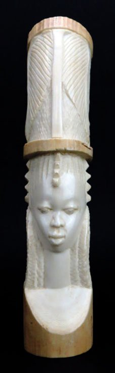 ANTIQUE CARVED AFRICAN ELEPHANT TUSK: ANTIQUE CARVED AFRICAN ELEPHANT TUSK Measures 11.5" tall and is carved into the head of a young African Lady. Circa late 19th century in good condition. Please note the ivory was legally imported into