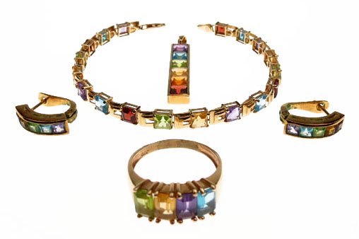5 PIECES OF 14KT YELLOW GOLD AND GEMSTONE SUITE: 5 PIECES OF 14KT YELLOW GOLD AND GEMSTONE SUITE Weighing 12dwt with Peridot Amethyst, Yellow Sapphire and Blue Topaz Stones Ring Size 7.5, Pendant approx 1.5" long, Bracelet approx 7" long We will not