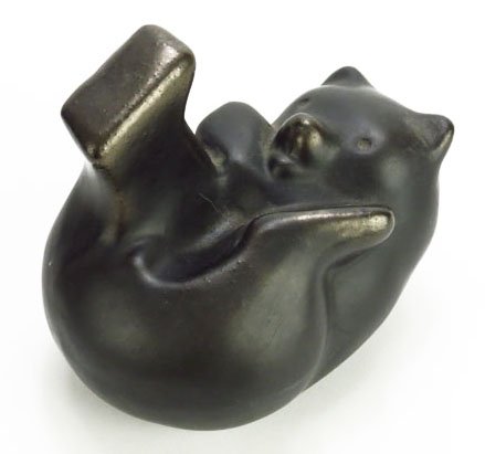 RARE PIGEON FORGE POTTERY FIGURINE OF A GRIZZY BEAR: approx 6" long 5" tall depicting a bear laying on his back. Signed Pigeon Forge to base. Light rubbing otherwise good condition. We will not ship this lot but we can recommend one of our local shipper