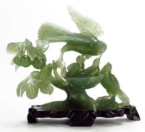 VINTAGE CHINESE JADE CARVING OF BIRDS NESTING: VINTAGE CHINESE JADE CARVING OF BIRDS NESTING measures 6.5" tall 7"wide comes with fitted wooden base mid 20th century very good condition We will not ship this lot but we can recommend one of our loc