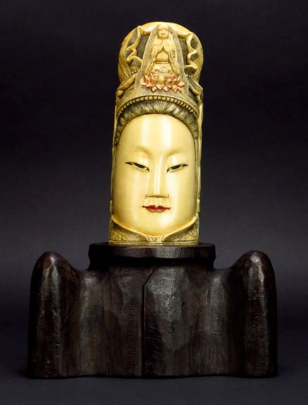 19TH CENTURY IVORY CARVING OF A QUAN YIN WITH BUDDHA: 19TH CENTURY IVORY CARVING OF A QUAN YIN WITH BUDDHA measures 5.5" tall with small Buddha praying on her head sits on 3" footed base signed to base in black. This ivory was imported legally to the Uni