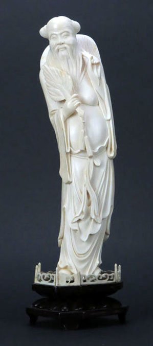 Very Fine Chinese Carved Ivory Figure of a Man with Hat: Very Fine Chinese Carved Ivory Figure of a Man with Hat and Fan, Very Good Condition, Mounted on a Hard Wood Base, Measures 10 Inches Tall, 3 Inches Across and 2-1/2 Inches Wide, Estimate $400-600 WE 
