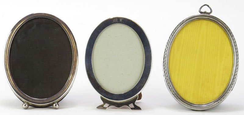 Three (3) Sterling Silver Oval Picture Frames. Good: Three (3) Sterling Silver Oval Picture Frames. Good Condition. Measures: 5 Inches. Shipping $20.00