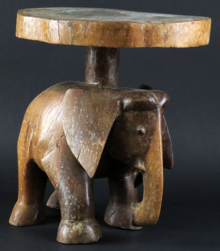 Miniature African Carved Wooden Elephant Stool. Good: Miniature African Carved Wooden Elephant Stool. Good Condition. Measures 12-1/2 Inches Tall and 12 Inches Long. Very Heavy. Shipping $75.00
