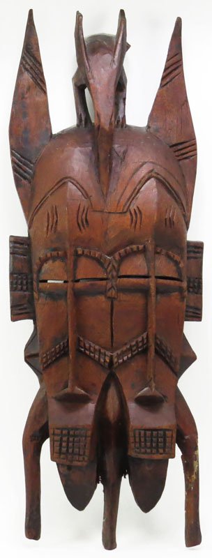 African Carved and Painted Wooden Mask. Was Used as a: African Carved and Painted Wooden Mask. Was Used as a Wall Hanging. Unsigned. A Few Cracks and What Looks like a Repair or else Good Condition. Measures 20-1/2 Inches by 7-1/4 Inches. Shipping $40.00
