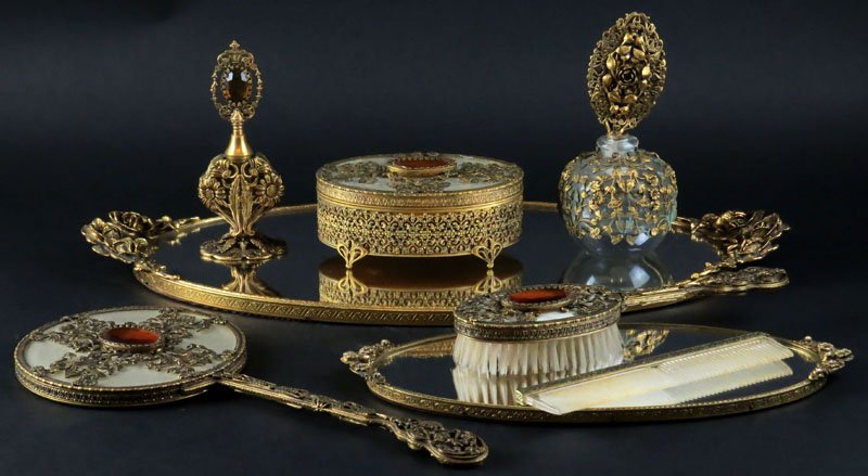 Eight (8) Piece Assembled Vanity Dresser Items: Eight (8) Piece Assembled Vanity Dresser Items Including: Two (2) Vanity Trays, Dresser Box, Scent Bottle, Perfume Bottle, Mirror, Brush and Comb. Shipping $65.00