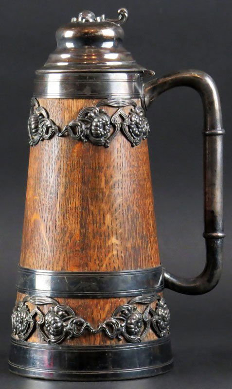 Continental Art Nouveau Carved Oak and Silver Plate: Continental Art Nouveau Carved Oak and Silver Plate Beer Stein. Stamped on Base 4 and 0. Good Condition. Measures 11 Inches Tall and 5 Inches Diameter at Base. Shipping $20.00