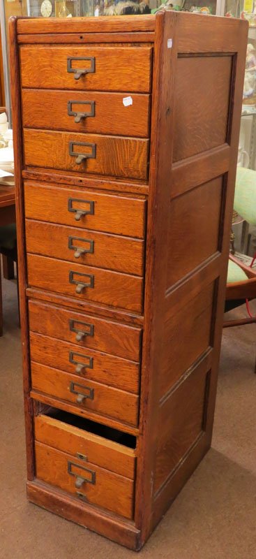 Antique Oak Filing Cabinet. Unsigned. Some Scratching: Antique Oak Filing Cabinet. Unsigned. Some Scratching or else Good Condition, Bottom Drawer Broken. Measures 52-1/4 Inches Tall, 14-3/4 Inches Wide and 19-1/2 Inches Depth. We Will Not Ship This Item 