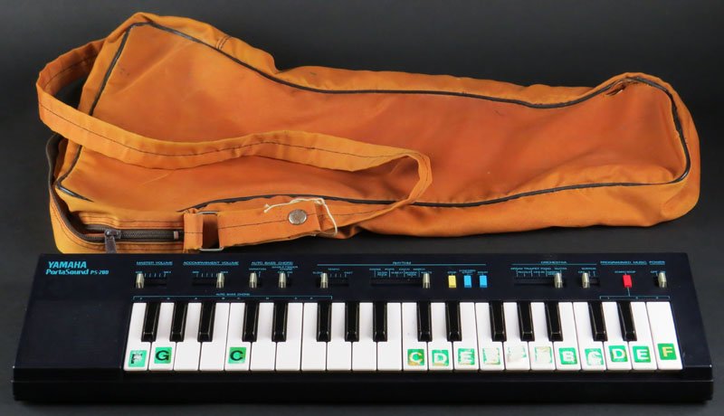 Yamaha PortaSound PS-200 Keyboard with some Paperwork: Yamaha PortaSound PS-200 Keyboard with some Paperwork in Plastic Holding Sack. Some Lettering to Keys Coming Off or else Overall Good Condition. No Cord. Not Presently Working, May Need Batteries. Mea