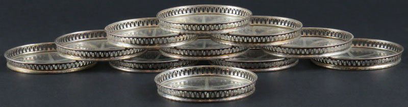Set of Eleven (11) Sterling Silver Rimmed Glass: Set of Eleven (11) Sterling Silver Rimmed Glass Coasters. Signed Sterling. Good Condition. Each Measures 3-1/8 Inches Diameter. Shipping $20.00