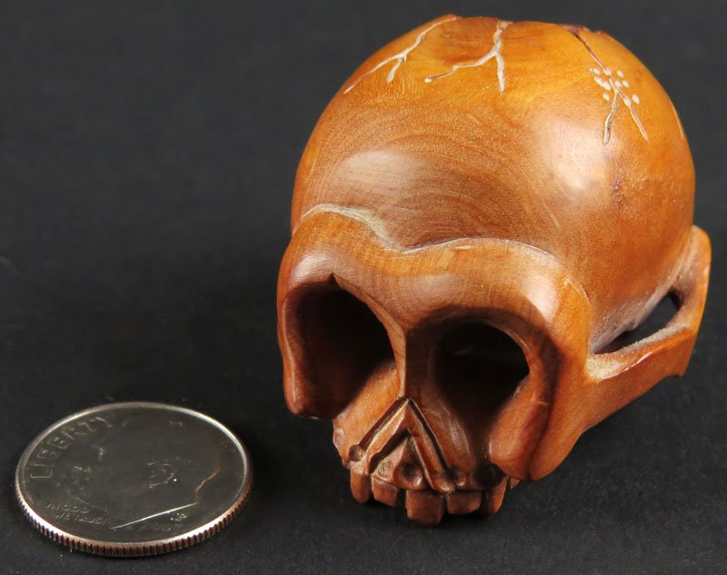 Japanese Carved Wooden Skull Netsuke. Signed on: Japanese Carved Wooden Skull Netsuke. Signed on Cartouche. Good Condition. Measures 1-1/4 Inches Tall and 1-1/2 Inches Long. Shipping $20.00