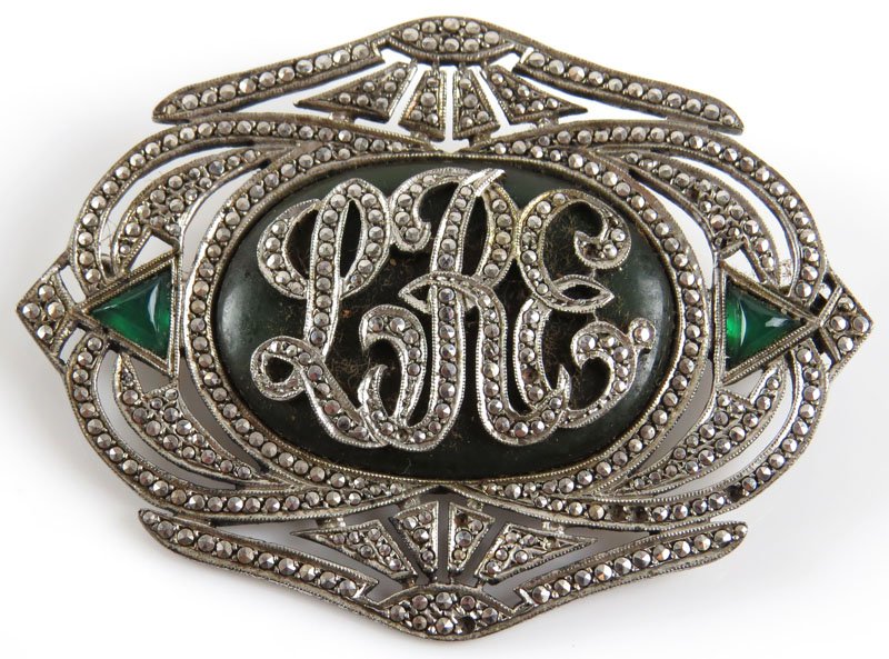 Art Deco Sterling Silver, Marcasite and Trilliant Cut: Art Deco Sterling Silver, Marcasite and Trilliant Cut Faux Emerald Inlay Initial Pin. Signed Sterling. A few Marcasites Missing or else Good Condition. Weighs 12.00 Pennyweights. Measures 1-3/4 Inches