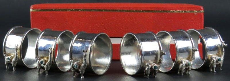 Boxed Set of Six (6) Sterling Silver Napkin Rings with: Boxed Set of Six (6) Sterling Silver Napkin Rings with Llama Decoration. Signed Peru and 925. Good Condition. Weighs 3.26 Troy Ounces. Shipping $20.00