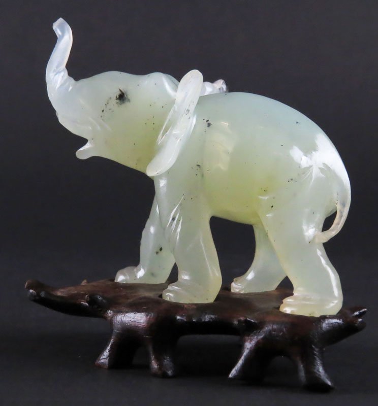 Carved Jade Elephant on Fitted Stand. Unsigned. Break: Carved Jade Elephant on Fitted Stand. Unsigned. Break at Tip of Trunk or else Good Condition. Measures 3 Inches Tall on Base. Shipping $20.00