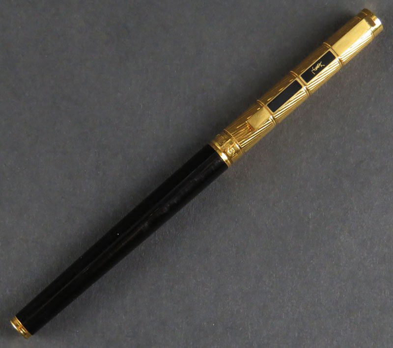 Yves Saint Laurent Ballpoint Pen. No Box, No Paperwork.: Yves Saint Laurent Ballpoint Pen. No Box, No Paperwork. Signed. Good Condition. Measures 5-3/8 Inches. Shipping $20.00