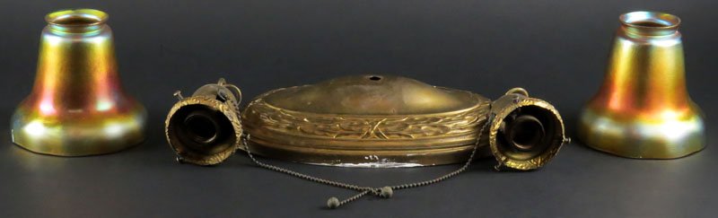 Pair of Steuben Aurene Iridescent Glass Shades, with a: Pair of Steuben Aurene Iridescent Glass Shades, with a Brass Ceiling Mount, 2 Light Fixture. Shades Signed Steuben. One with Rim Chip. The Shades Measure 4-1/2 Inches Tall, 2-1/4 Inches Diameter at To