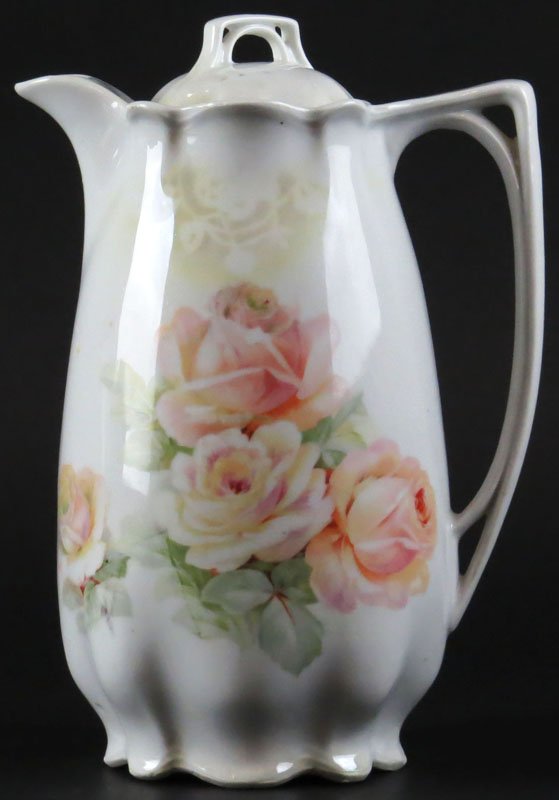Vintage German Porcelain Chocolate Pot together with: Vintage German Porcelain Chocolate Pot together with Four (4) Matching Cups. Good Condition. Pot Measures 9-1/8 Inches Tall and 6-1/2 Inches Long. Shipping $33.00