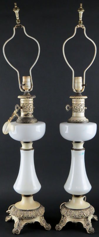 Pair of Mid Century White Opaline Glass and Metal: Pair of Mid Century White Opaline Glass and Metal Lamps. Unsigned. Wear to paint or else Good Condition. Measures 37-1/2 Inches Tall to Finials. We Will Not Ship This Item In-House Due to Its Size, Bu