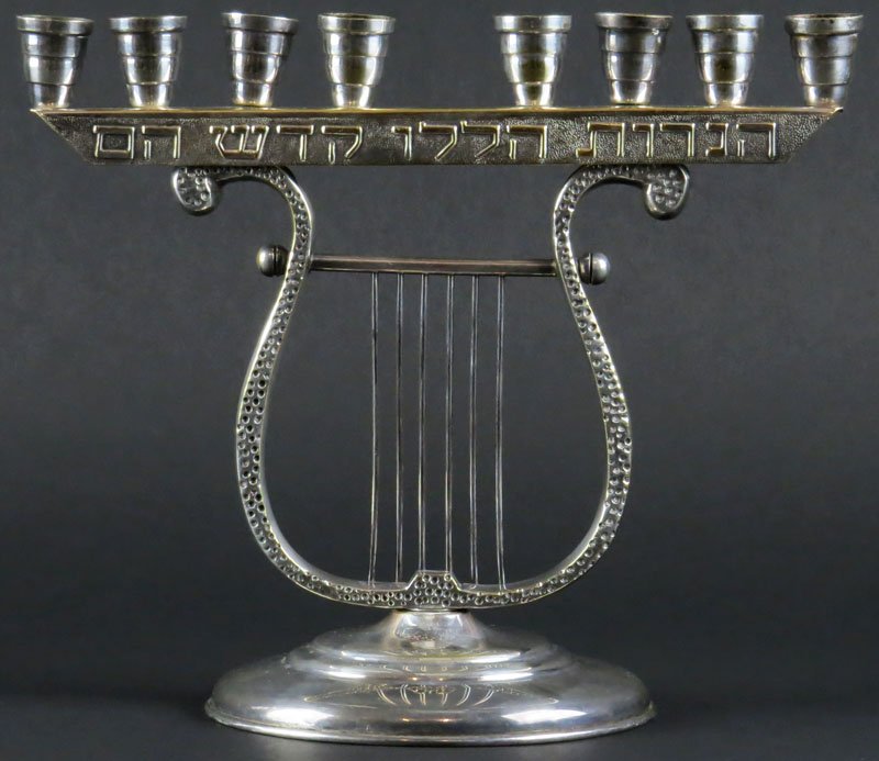 Silver Plate Menorah with Eight (8) Candle Holders with: Silver Plate Menorah with Eight (8) Candle Holders with Harp Design. Missing shamus. Good Condition. Measures 7-5/8 Inches by 9-3/8 Inches Long. Shipping $20.00itcher with Presentation. Unsigned.