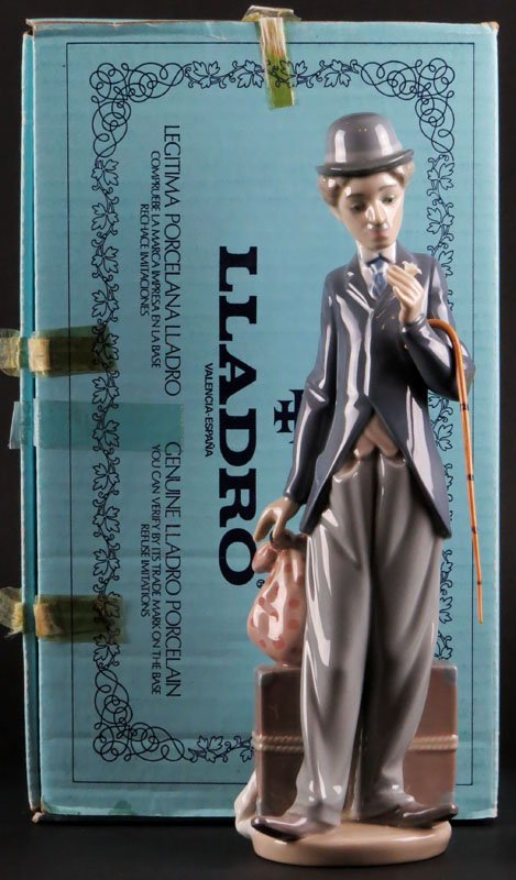 Lladro Porcelain Charlie Chaplin #5233 "Little Tramp": Lladro Porcelain Charlie Chaplin #5233 "Little Tramp" with Original Box. Very Good Condition. Measures 11-1/4 Inches Tall. Shipping $30.00
