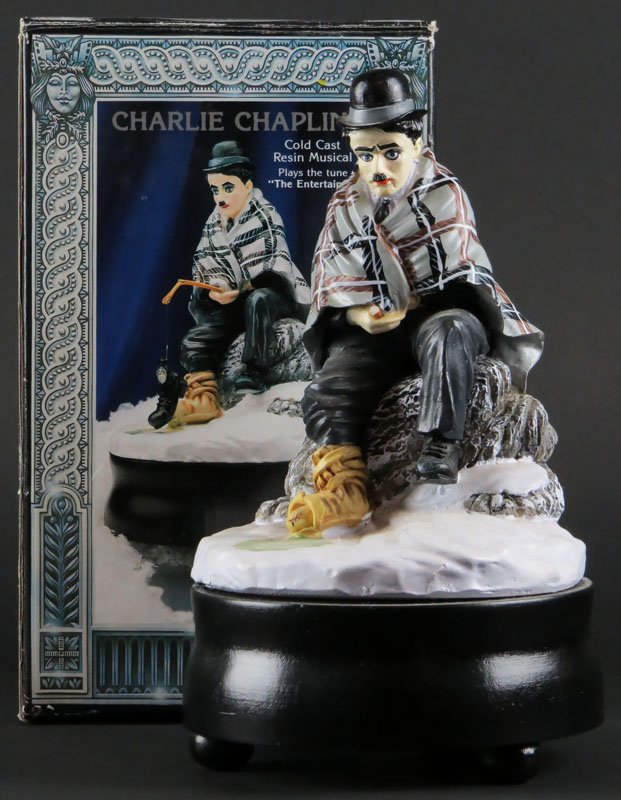 Enesco "Stars of the Silver Screen" Charlie Chaplin: Enesco "Stars of the Silver Screen" Charlie Chaplin Cold Cast Resin Musical. Plays the Tune "The Entertainer" in Original Box. Very Good Condition. Plays. Measures 9 Inches Tall. Shipping $20.00