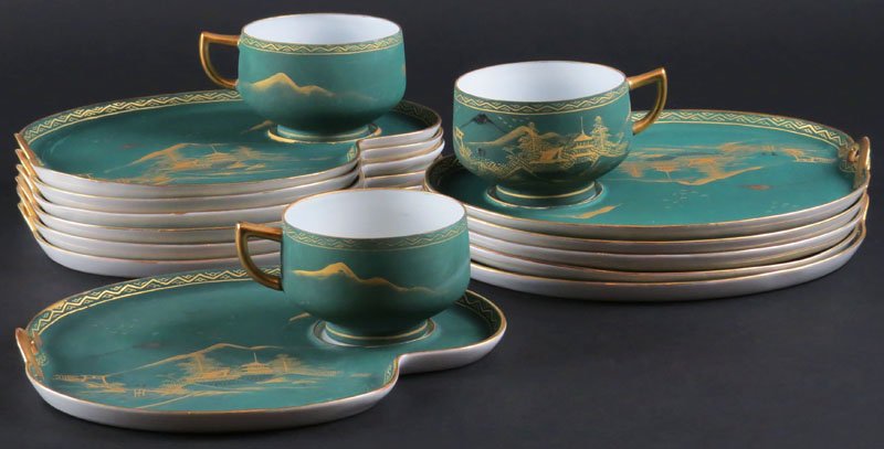 Twelve (12) Japanese Porcelain Breakfast Plates with: Twelve (12) Japanese Porcelain Breakfast Plates with Three (3) Matching Cups in the Mount Fuji Pattern. Signed Japanese Characters. Good Condition, a few with Rubbing. Measures 8-1/2 Inches Wide. Ship
