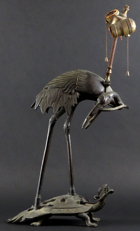 Asian Bronze Turtle Lamp with Bird. Unsigned. Small: Asian Bronze Turtle Lamp with Bird. Unsigned. Small Hairline Crack to Base. Some Wear to Finish. Lighting Assemble Incomplete. Measures 15 Inches to Top of Figure. Shipping $60.00
