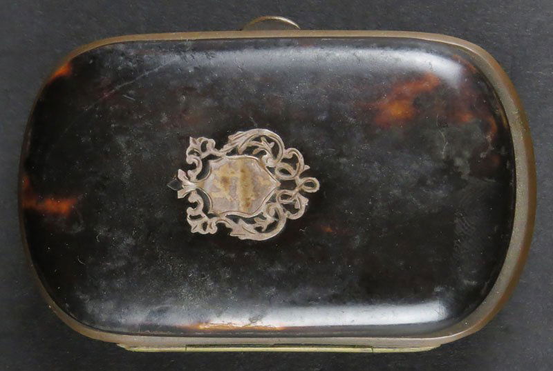 19th Century English Tortoise Shell Change Box with: 19th Century English Tortoise Shell Change Box with Silver Inlay. Section Cloth Interior. Unsigned. Separation, Scratches Minor Dings. Measures 3-1/4 Inches by 2 Inches. We Will Not Ship This Item Out