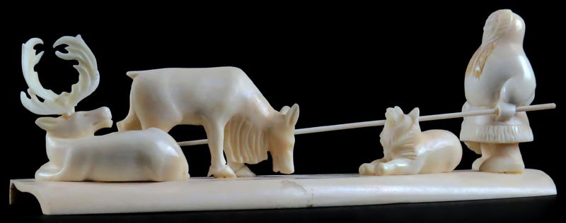 Well Carved Inuit Eskimo Ivory Sculpture. Unsigned.: Well Carved Inuit Eskimo Ivory Sculpture. Unsigned. Antler Missing or else Good Condition. Measures almost 3 Inches tall and 7-7/8 Inches Wide. This item will only be shipped domestically and was lega