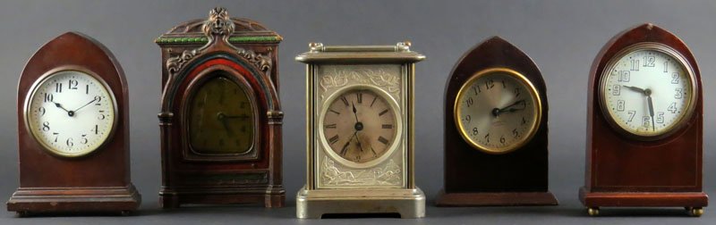 Lot of Five (5) Assorted Clocks. One signed: Lot of Five (5) Assorted Clocks. One signed "Peep-O-Day". One Signed "Symphony". One Signed "Seth Thomas". Some in Working Condition. Some Scratches and Chips to Wood and Scratches and Tarnish to Meta