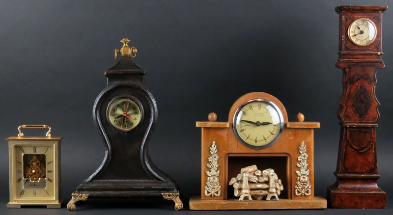 Four (4) Assorted Clocks. Two Signed "Quartz". Clocks: Four (4) Assorted Clocks. Two Signed "Quartz". Clocks may not be in Working Condition. Some Scratching to Wood or else Good Condition. Largest Clock Measures 15-1/2 Inches Tall and 4-1/4 Inches Wide. 