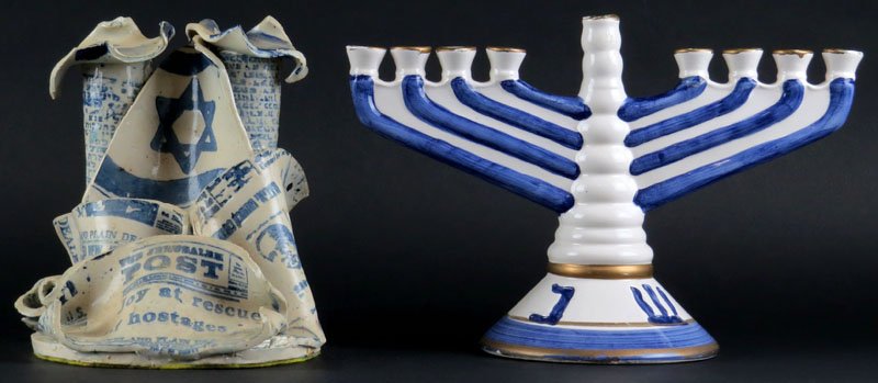 Two (2) Israeli Blue and White Ceramic Pieces: Two (2) Israeli Blue and White Ceramic Pieces Including: Candle Holder with Jerusalem Post Headlines and World Bazaar Menorah. Good Condition. Candle Holder Measures 7 Inches Tall and Menorah Measures