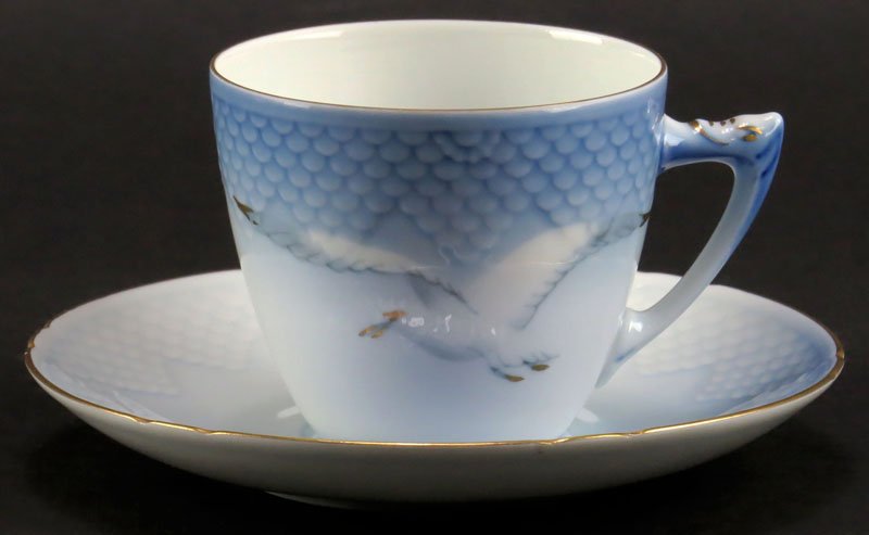 Eight (8) Bing and Grondahl Royal Copenhagen Denmark: Eight (8) Bing and Grondahl Royal Copenhagen Denmark Porcelain Tea Cups together with Nine (9) Matching Saucers with Gilt Trim in the Seagull Pattern. Signed. Good Condition. Tea Cup Measures 2-1/2 In