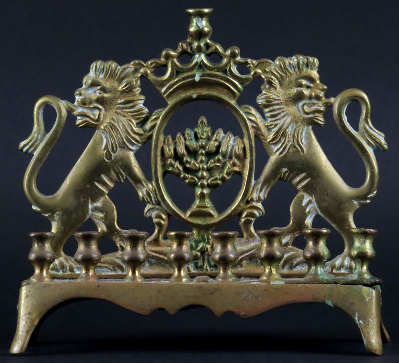 Early 20th Century Russian Brass Menorah. Unsigned.: Early 20th Century Russian Brass Menorah. Unsigned. Some Tarnish and Lower Right Candle Holder Piece Slightly Bent or else Good Condition. Measures 7 Inches Tall and 7 Inches Wide. Shipping $20.00