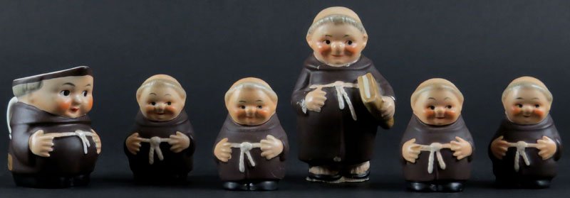 Collection of Six (6) Hummel Porcelain Figures of: Collection of Six (6) Hummel Porcelain Figures of Monks. Includes Four (4) Salt and Pepper Shakers, One (1) Creamer, and One (1) Larger Figure. Larger Figure with Chips to Sleeves and to Base. Other F