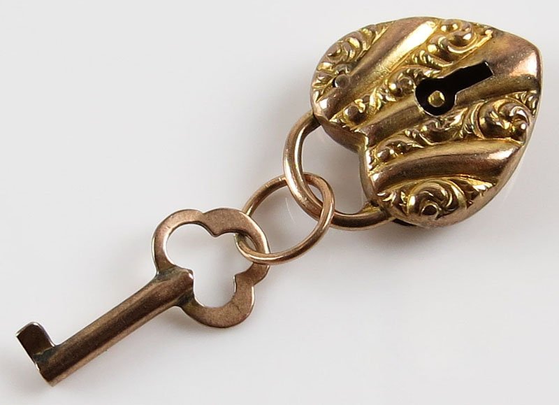 Vintage 14 Karat Yellow Gold Lock and Key Charm.: Vintage 14 Karat Yellow Gold Lock and Key Charm. Unsigned. Good Condition. Gross Weighs 1.20 Pennyweights. Shipping $20.00
