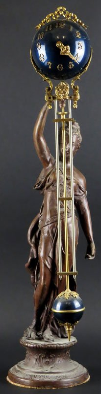 French Metal Swinger Clock. Clock Appears to be not run: French Metal Swinger Clock. Clock Appears to be not running. Some Wear to Finish. Good Condition. Measures 29 Inches Tall. Shipping $100.00