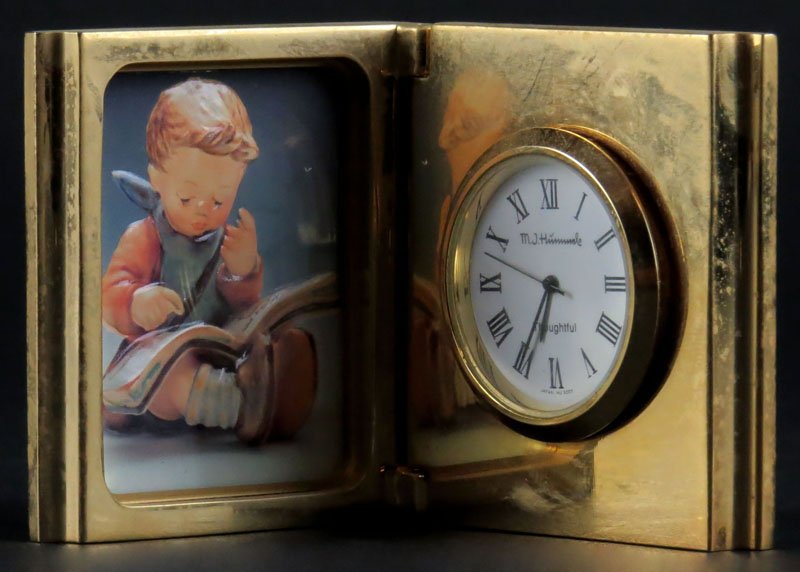 Hummel Brass Desk Clock. Closes to Resemble Book.: Hummel Brass Desk Clock. Closes to Resemble Book. Signed. Good Condition. Measures 2-1/4 Inches by 2 Inches when Closed. Shipping $20.00