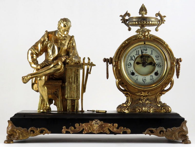 19/20th Century New Haven Clock Company White Metal: 19/20th Century New Haven Clock Company White Metal Figural Mantle Clock with Gilt Finish and Porcelain Dial. Good Condition. Signed. Has Key and Pendulum. Some Wear to Finish or else Good Condition. 