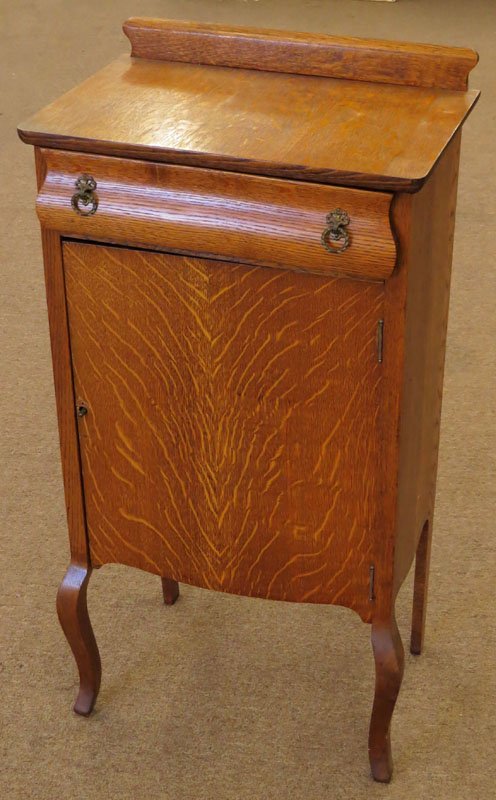 Vintage to Antique Tiger Oak Music Cabinet with Drawer: Vintage to Antique Tiger Oak Music Cabinet with Drawer and Shelving Interior. Unsigned. Good Condition. Measures 39 Inches Tall and 18-3/8 Inches Wide. We Will Not Ship This Item In-House Due to Its S