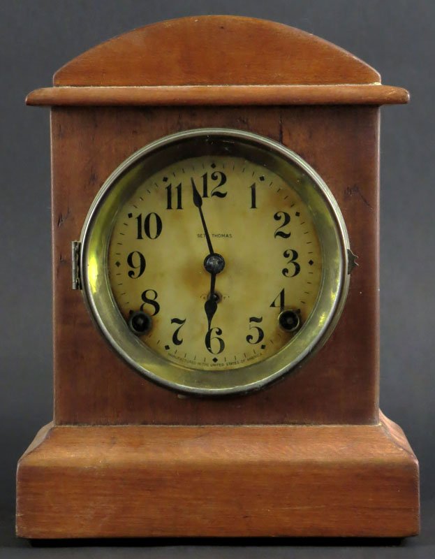 Seth Thomas Wooden Mantle Clock with Time and Strike.: Seth Thomas Wooden Mantle Clock with Time and Strike. Has Key and Pendulum. Good Condition, Musty Smell Measures 11 Inches Tall and 8 Inches Diameter. Shipping $36.00