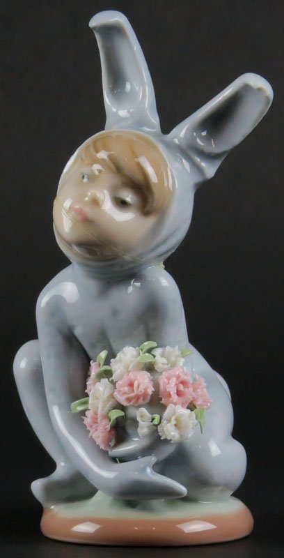 Lladro Porcelain Figure "Boy in Bunny Rabbit Suit": Lladro Porcelain Figure "Boy in Bunny Rabbit Suit" Signed. Head Broken and Glued Back. Please Examine These Carefully Before Bidding. We are Selling this Lot in "AS IS" Condition. Shipping $20.00