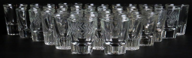 Collection of Twenty Seven (27) Shot Glasses. Three (3): Collection of Twenty Seven (27) Shot Glasses. Three (3) Different Makers/Styles. Unsigned. Good Condition. Average Measures 13-1/2 Inches Wide. Shipping $36.00
