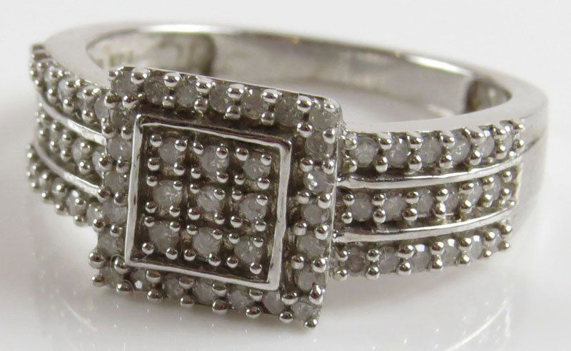 Diamond and Sterling Silver Ring, Size 7-3/4. Signed: Diamond and Sterling Silver Ring, Size 7-3/4. Signed 925 and KPJ Makers Mark. Good Condition. Weighs 2.70 Pennyweights. Shipping $20.00