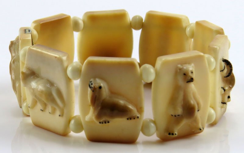 Vintage Eskimo Inuit Carved Walrus Ivory Bracelet with: Vintage Eskimo Inuit Carved Walrus Ivory Bracelet with Original Sticky Label. Provenance: North Miami Beach Private Collection. Elastic Bands Allow Adjustable Sizing. Unsigned. Good Condition. Each Pa