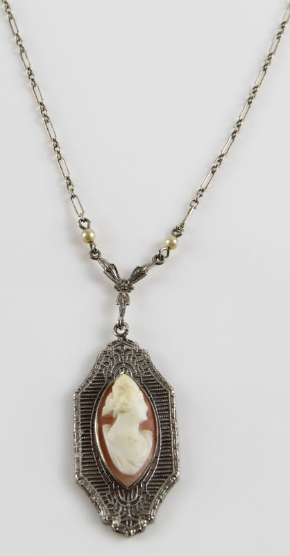 Victorian 10 Karat White Gold Necklace with Seed Pearl: Victorian 10 Karat White Gold Necklace with Seed Pearl Spacers and Carved Shell Cameo Pendant. Signed. Good Used Condition. Gross Weighs 2.50 Pennyweights. Necklace Measures 16 Inches. Shipping $20.00